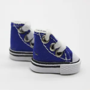 Detailed view of 3.5cm miniature blue canvas doll shoes with white laces and soles