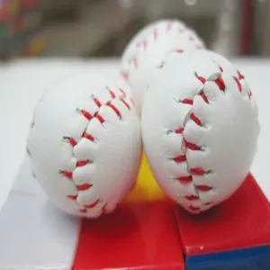 Close-up of mini baseball keychain pendants with realistic red stitching details.