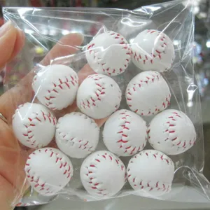 Detail view of mini baseball charms in a plastic bag for DIY keychain accessories.
