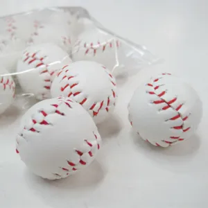 Close-up detail of mini white faux leather baseballs with red hand-stitched seams