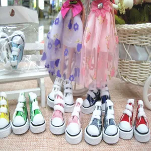Collection of 3.5cm mini canvas shoes for dolls in various colors like pink and blue