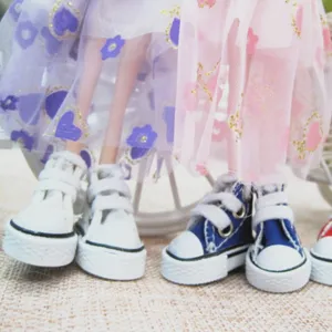 Detailed view of 3.5cm mini canvas sneakers for dolls and keychains in blue and white