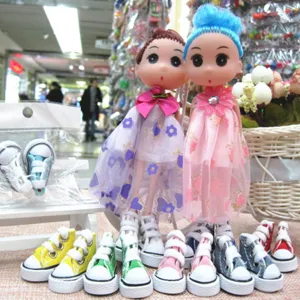 Collection of colorful 3.5cm mini canvas shoes for dolls and toy accessories shown in detail