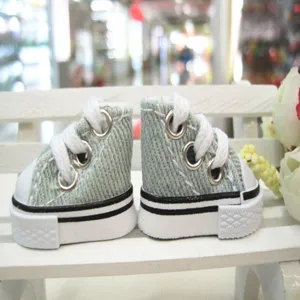 Detailed close-up view of 3.5cm miniature high-top canvas doll shoes in denim blue finish