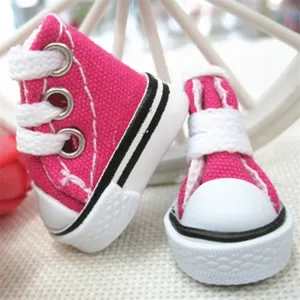 Close-up detail of mini 3.5cm pink canvas sneakers for dolls and keychain accessories