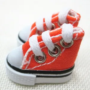 Detailed view of 3.5cm miniature orange canvas sneakers for doll accessories or keychains