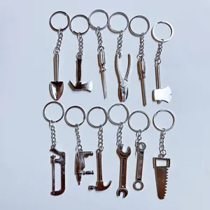 Detailed collection of 12 miniature stainless steel tool keychains with various hardware shapes