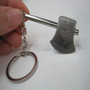 Close-up of a miniature metal axe keychain with a durable silver-finish ring