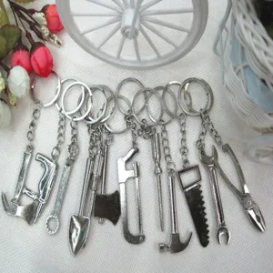 Set of silver metal miniature tool charms for keychains including axe saw and hammer