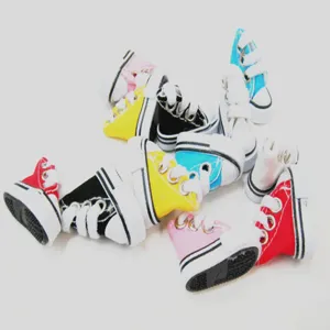 Macro view of colorful 3.5cm mini canvas shoes for doll accessories or keychains