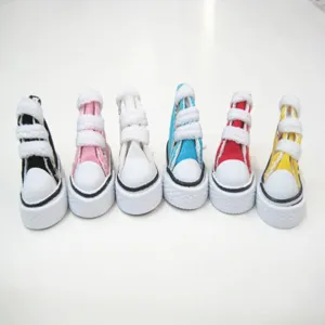 Detailed view of six colorful 3.5cm miniature canvas shoes for dolls and keychains