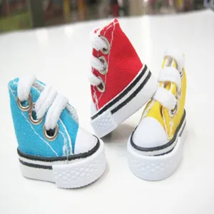 Detailed view of 3.5cm colorful miniature canvas shoes for dolls and keychain accessories.
