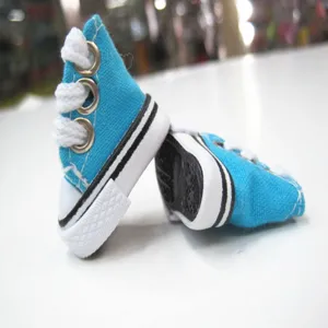 Macro view showing details of blue 3.5cm mini canvas shoes for dolls and keychains