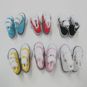 Close-up of colorful 3.5cm miniature canvas shoes for dolls and keychain accessories