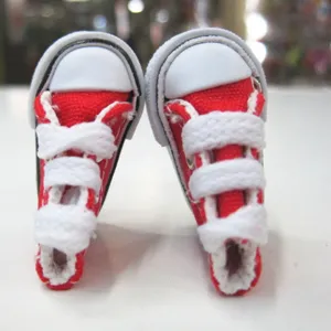 Macro view of detailed red 3.5cm mini canvas sneakers for dolls and cute keychains