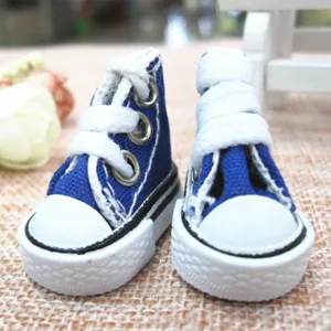 Detailed macro view of 3.5cm miniature blue canvas sneakers for dolls and keychains