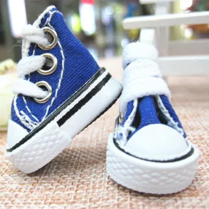 Macro view of blue 3.5cm miniature canvas sneakers for dolls and keychains accessory