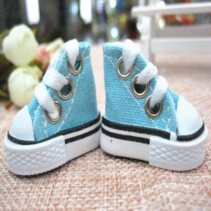Detailed macro view of 3.5cm sky blue mini canvas sneakers for dolls and craft keychains