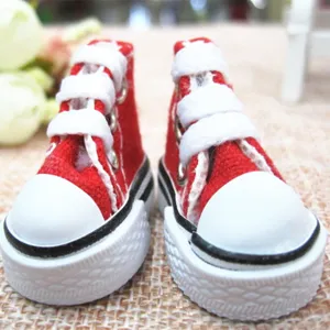 Detailed view of miniature 3.5cm red canvas doll sneakers for Barbie doll accessories