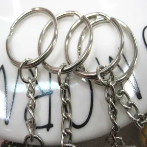 Macro view of 2cm silver metal keyring loops and attached chains for sports keychains