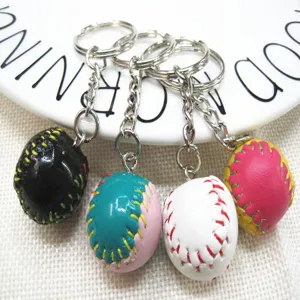 Detailed view of mini 2cm baseball keychains in various colorful hand-stitched styles.