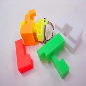 Detailed macro view of 2.5cm colorful plastic interlocking puzzle block keychain toy