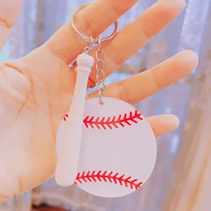 Close-up detail of a DIY acrylic baseball keychain with mini bat and red stitching