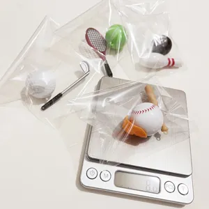 Set of miniature sports ball keychains individually packed in clear plastic bags