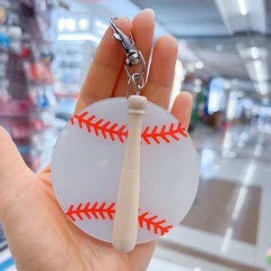 Creative acrylic baseball keychain with mini wooden bat charm for sports fans.