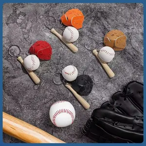Close-up of mini baseball keychains with tiny bats and gloves in multiple colors