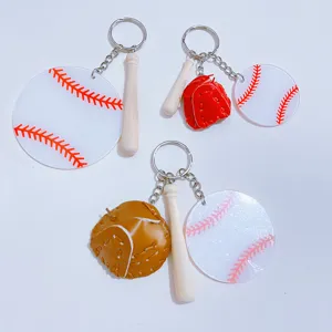 Detail view of acrylic baseball keychains featuring mini bats and colorful gloves