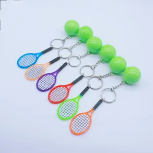 Detailed view of colorful mini tennis racket and ball keychains in various bright colors