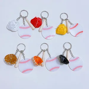 Detailed view of six colorful baseball keychains with mini gloves and wooden bats.