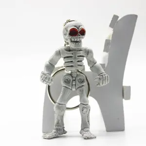 Full body detailed view of a Halloween skeleton keychain with striking red eyes decoration