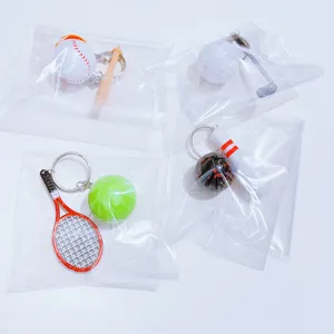 Mini sports keychains showing baseball, golf, tennis, and bowling in individual packaging.
