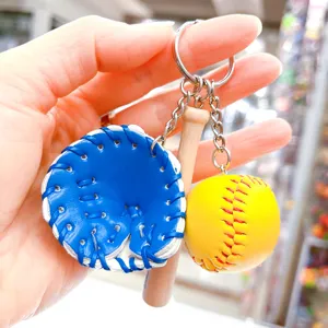Detailed view of sports keychain featuring mini baseball glove wooden bat and yellow ball