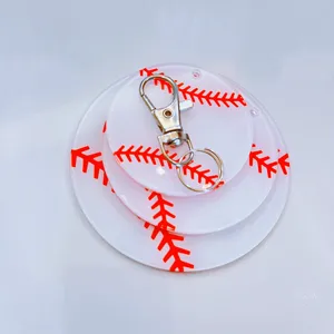 Detail of tiered acrylic baseball keychain with vibrant red stitching and metal clasp