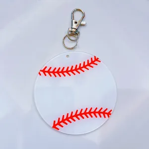 Detail of acrylic baseball keychain with red stitch print and metal clasp