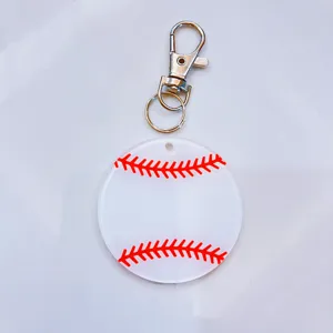 Close-up of acrylic baseball keychain with red stitching and silver metal clasp