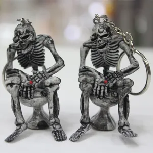Detailed view of creative skeleton sitting on toilet keychain for Halloween gifts