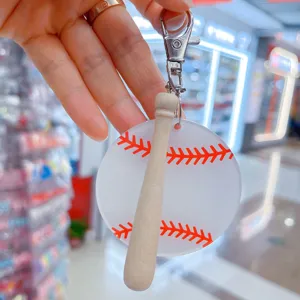 Creative acrylic baseball keychain featuring a mini wooden bat pendant for sports fans