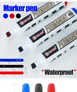 Detailed shot of three permanent markers showing blue, red and black ink with waterproof effect