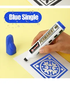 Detailed view of a blue permanent marker pen creating a waterproof blue pattern on paper