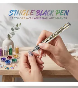 Close-up of a 0.5mm black nail art marker pen drawing fine lines on a fingernail.