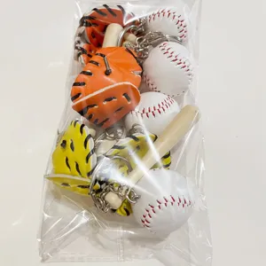 Set of baseball keychains featuring a mini wood bat and glove charm in clear packaging