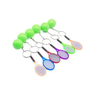 Set of six colorful mini tennis racket and ball keychains for sports fans and gifts.