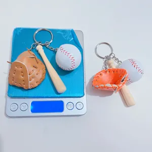 Detailed weight measurement of baseball glove bat and ball keychain on digital scale