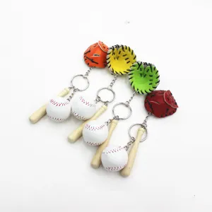 Collection of sports baseball keychains with wooden bats and colorful gloves in a row