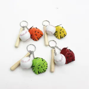 Four colorful mini baseball glove and wooden bat keychains set on a white background