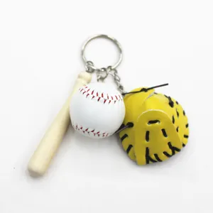 Detailed close-up of a sports-themed baseball keychain with a mini bat and glove